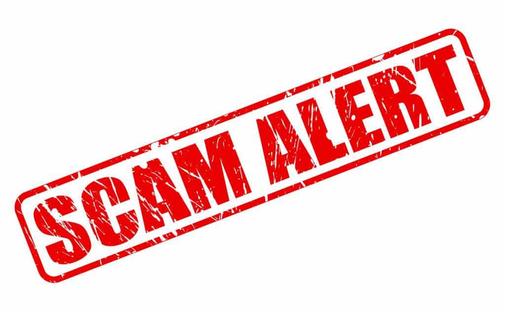 SCAM alert red stamp text